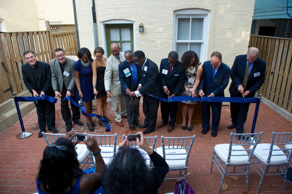 black house reception and dedication ribbon cutting ceremony with georgetown blue ribbon